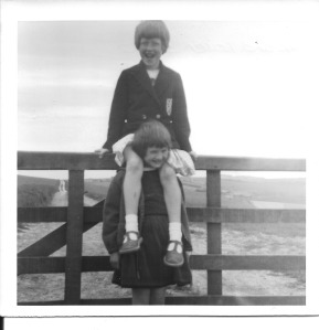 Here I am sitting on a fence, my legs astride Karen!